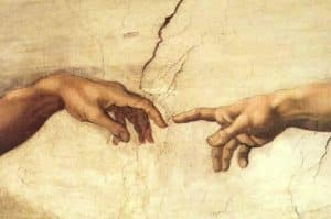 Les deux mains du tableau La création d'Adam de Michel-Ange